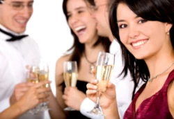 young woman with friends and toasting glass