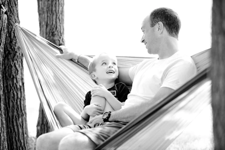 father and son in hammock
