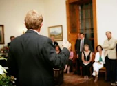 Man speaking to group at meeting