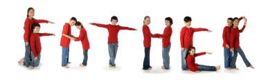 Kids who are using their bodies to spell out each letter in the word "Father."