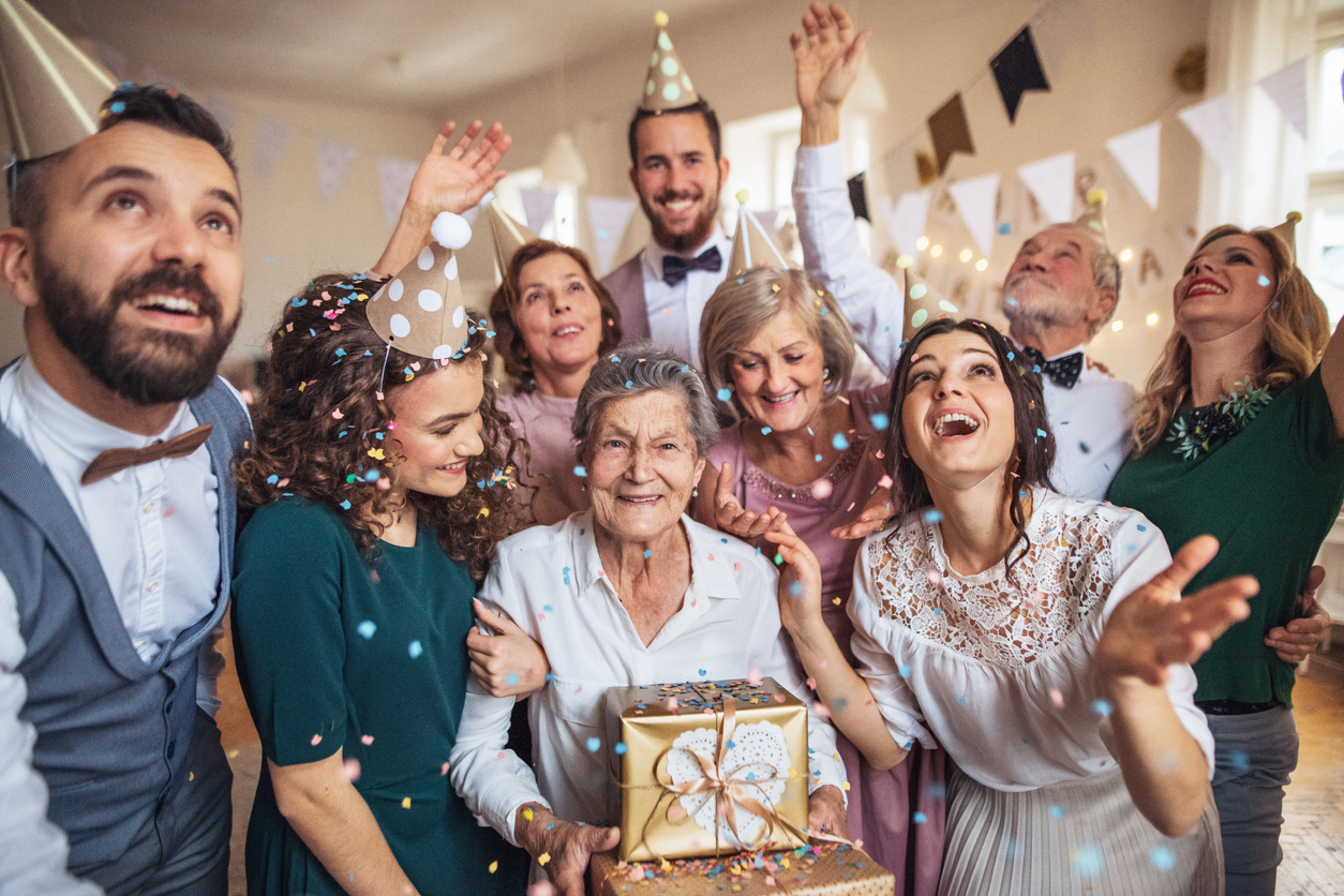 family celebrating 80th birthday party