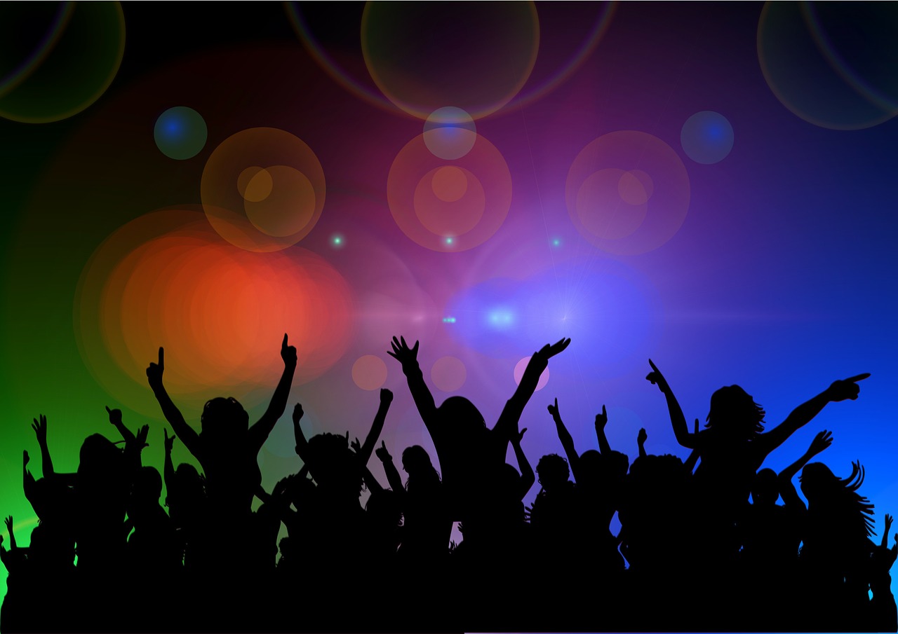 Celebration with stage lights and figures cheering